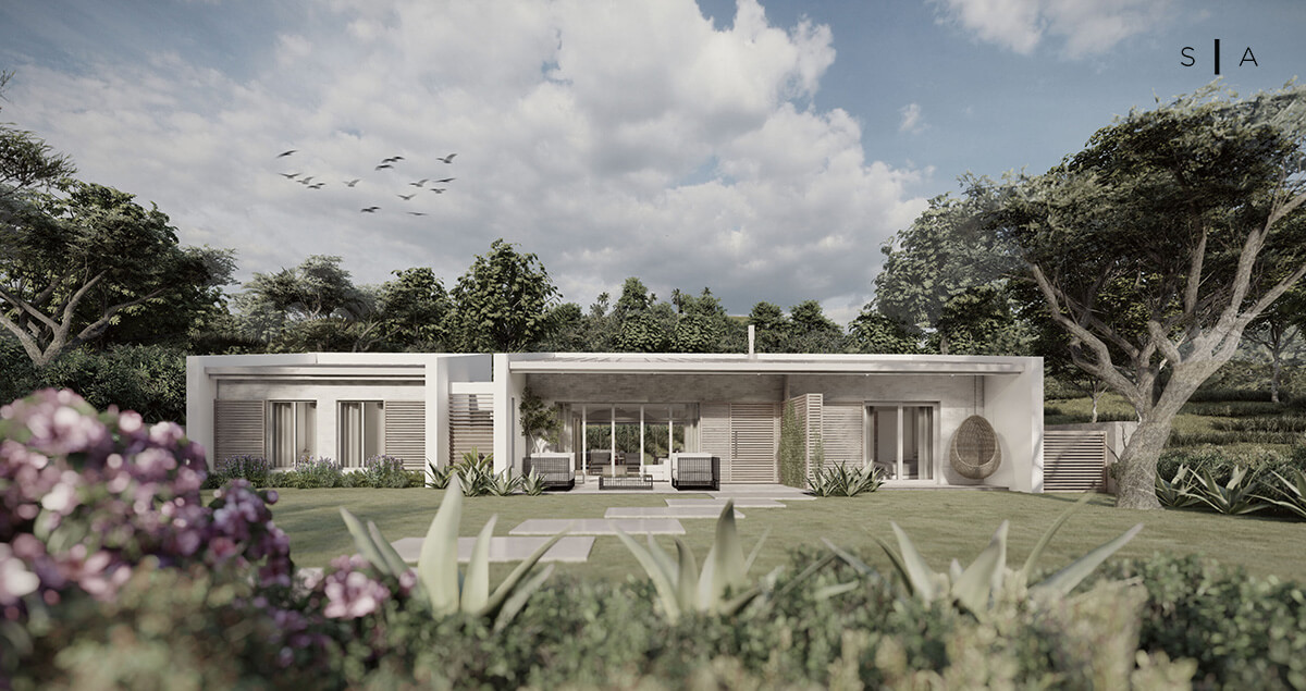 Front entrance elevation of a contemporary beach cottage set within a landscaped coastal garden.